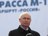 Russian President Vladimir Putin before a podium at a ceremony
