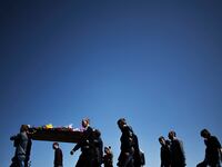 articles/2014/09/14/bitter-survivors-and-caravans-of-coffins-from-ukraine-s-eastern-boiler/140913-Nemtsova-ukraine-coffins-tease_tvs0fp