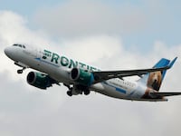 A Frontier Airlines Airbus A320 airplane departs Los Angeles International Airport on March 30, 2025.