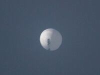 A balloon flies in the sky over Billings, Montana.