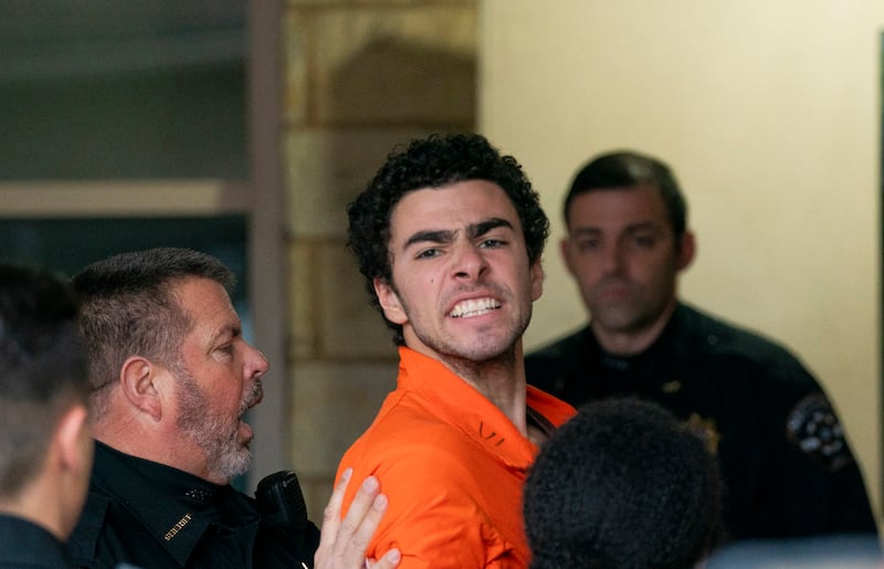 Suspect Luigi Mangione is taken into the Blair County Courthouse.
