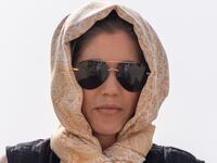 Homeland Security Secretary Kristi Noem rides a camel to a tour of Qal'at al-Bahrain Fort in Bahrain.