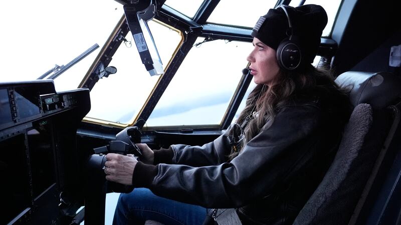 US Secretary of Homeland Security Kristi Noem helps fly an HC-130J during an aerial tour from US Coast Guard Air Station Kodiak on March 17, 2025, in Kodiak Station, Alaska.