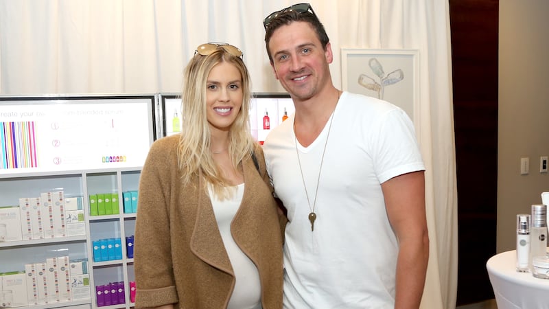 Ryan Lochte (R) and Kayla Rae Reid in 2017.