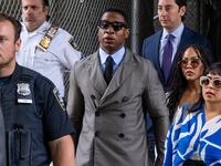 Jonathan Majors walks into court