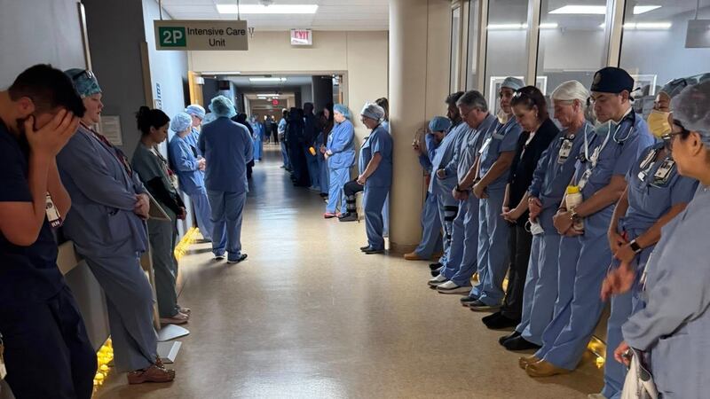 Alex Pretti's colleagues hold a moment a moment of silence at Minneapolis VA Health Care System hospital, in Minneapolis, Minnesota.