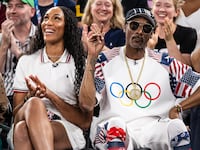 PARIS, FRANCE - AUGUST 06: A'ja Wilson of Team USA and Snoop Dogg attend the game during the quarterfinal between USA and Brazil