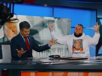 MAGA rapper Forgiato Blow and OAN host Dan Ball dance for the camera.