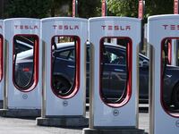 A Tesla car charges up at a Tesla Supercharger on May 2, 2024 in Petaluma, California.