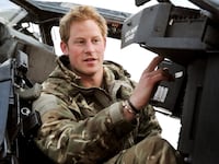 Prince Harry performs a pre-flight check on his Apache Helicopter after starting his 12 hour VHR (very high ready-ness) shift at the British controlled flight-line in Camp Bastion, southern Afghanistan, November 1, 2012.