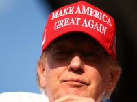 Donald Trump wearing MAGA hat.