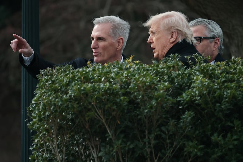 President Donald Trump talks with former U.S. Speaker of the House Kevin McCarthy as they depart the White House on Wednesday. It is unclear why the two met.