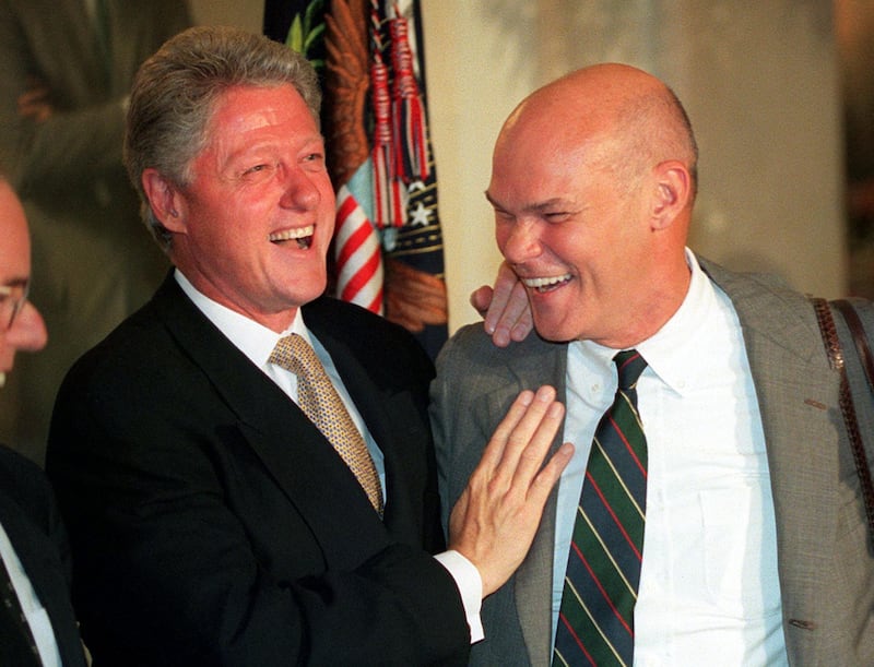WASHINGTON, : US President Bill Clinton and friend James Carville laugh 18 July, 1999, during a working dinner at the White House in Washington, DC. Israeli Prime Minister Ehud Barak said 18 July from the White House that he hoped to have a comprehensive Middle East peace within 15 months. AFP PHOTO Mario Tama (Photo credit should read MARIO TAMA/AFP via Getty Images)