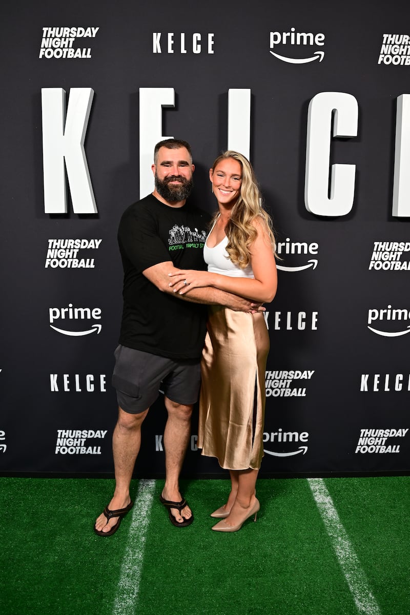 Jason Kelce famously loves flip-flops. Pictured with wife Kylie Kelce at the screening of his documentary 'Kelce' in Philadelphia in 2023.