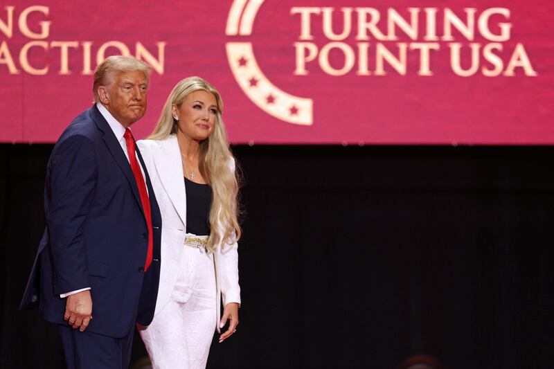President Donald Trump greets Erika Kirk, Charlie Kirk's widow, during the public memorial service for right-wing activist Charlie Kirk at State Farm Stadium in Glendale, Arizona, on September 21, 2025.