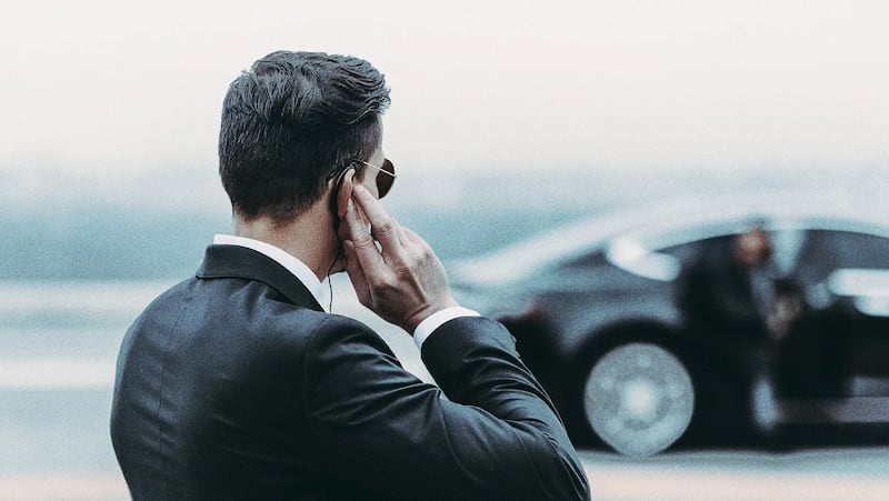 A bodyguard with an earpiece