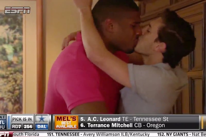 articles/2014/05/11/michael-sam-makes-nfl-history-the-first-openly-gay-player-drafted-by-the-st-louis-rams/140511-michael-sam-kiss-cheat_kgih9x