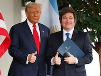 WASHINGTON, DC - OCTOBER 14: U.S. President Donald Trump (L) greets President of Argentina Javier Milei as he arrives at the West Wing of the White House on October 14, 2025 in Washington, DC. Trump is hosting Milei for a working lunch days after the U.S. Treasury finalized a $20 billion currency swap framework with Argentina in an effort to help stabilize its economy. (Photo by Kevin Dietsch/Getty Images)
