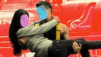 Fireman holding woman