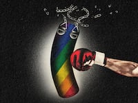 A boxing glove punches and breaks a rainbow-themed punching bag