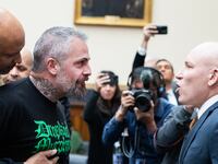 Former Metropolitan Police Officer Michael Fanone argues with far-right extremist Ivan Raiklin during a break in testimony by former Special Counsel Jack Smith before the House Judiciary Committee on January 22, 2026.