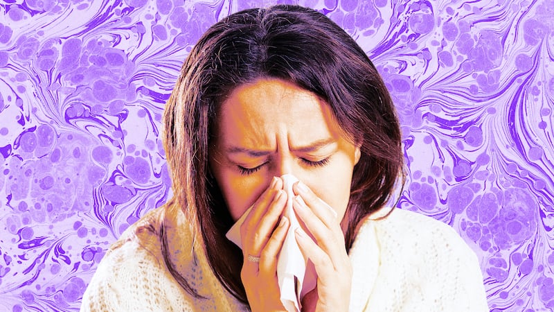 A photo illustration of a sick woman blowing her nose.