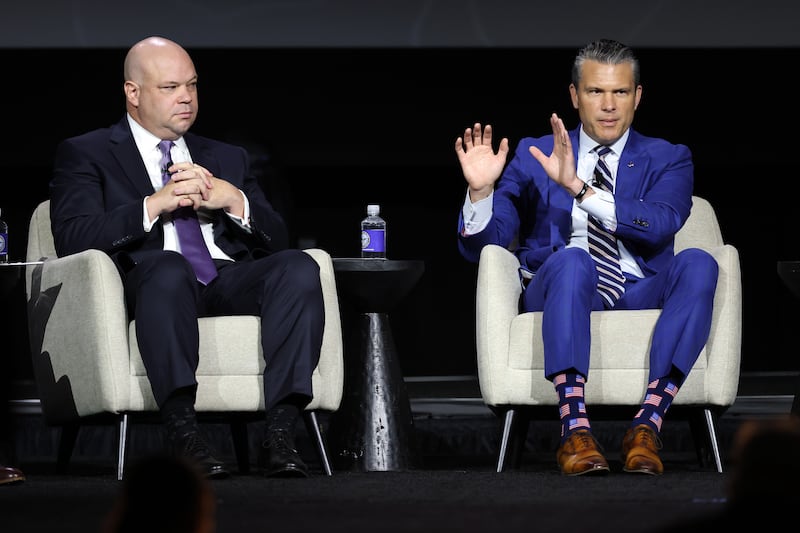Acting U.S. Secretary of the Army Adam Telle (L) and Secretary of War Pete Hegseth participate in a discussion during the U.S. Army's 2026 Annual Meeting and Exposition at the Walter E. Washington Convention Center on October 14, 2026 in Washington, DC. Secretary Hegseth participated in a discussion on the future of autonomous warfare.