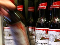 articles/2014/08/12/meet-the-beer-bottle-dictator/140811-mak-beer-tease_x7bmxm