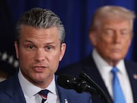 PALM BEACH, FLORIDA - JANUARY 03: U.S. Secretary of War Pete Hegseth speaks during a press conference with U.S. President Donald Trump at Mar-a-Lago club on January 03, 2026, in Palm Beach, Florida. During the event, President Trump confirmed that the U.S. military carried out a large-scale strike in Caracas overnight, resulting in the capture of Venezuelan leader Nicolas Maduro and his wife, Cilia Flores. (Photo by Joe Raedle/Getty Images)