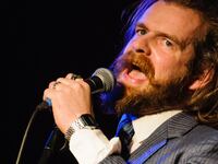 A close up shot of Paul Currie performing