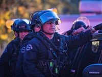 LAPD officers in riot gear exit USC after they cleared out a pro-Palestinian protest encampment on Sunday, May 5, 2024 in Los Angeles, CA.