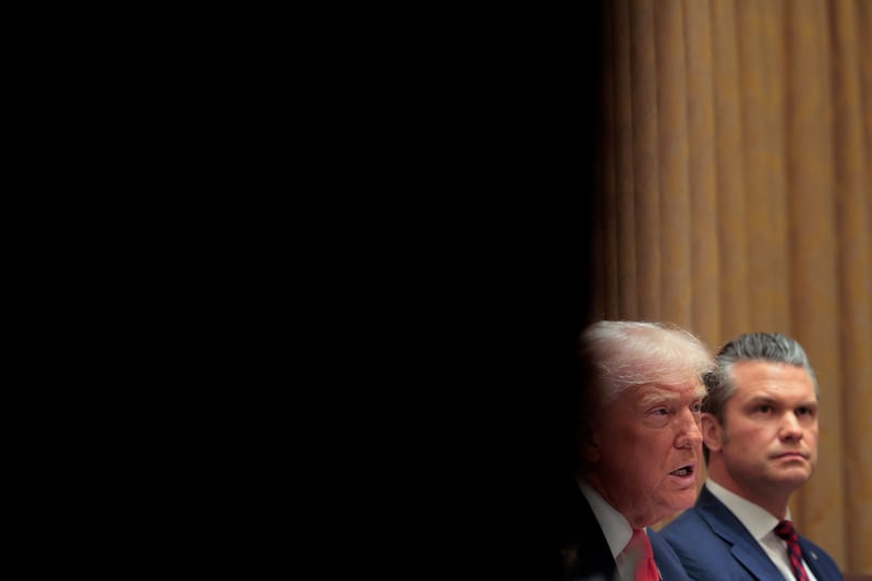 Pete Hegseth looks on as President Donald Trump speaks during a meeting in the Cabinet Room of the White House on December 2, 2025 in Washington, D.C.