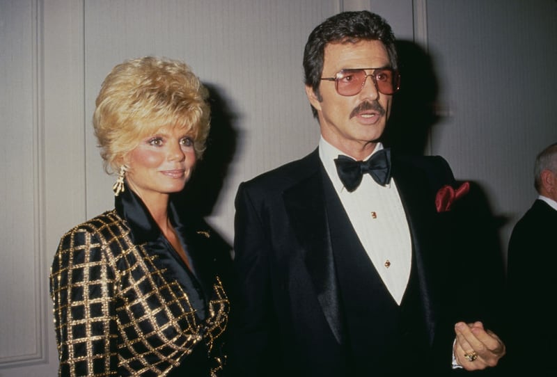 American actress Loni Anderson and American actor Burt Reynolds (1936-2018) attend the Friars Club of California's 8th Annual Lifetime Achievement Award Salute to Liza Minnelli, held at the Century Plaza Hotel in Los Angeles, California, 5th April 1987. (Photo by Vinnie Zuffante/Getty Images)