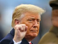 President Donald J. Trump walks on to the field before the first half of the Army-Navy game at Michie Stadium.