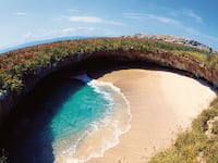 articles/2014/10/14/what-made-mexico-s-most-mysterious-beach/141013-presser-island-tease_frgrkr