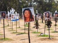 Photos of people killed or kidnapped during the Hamas attack on the Super Nova festival on October 7th are displayed in a temporary memorial site on January 04, 2024 in Re'im, Israel.