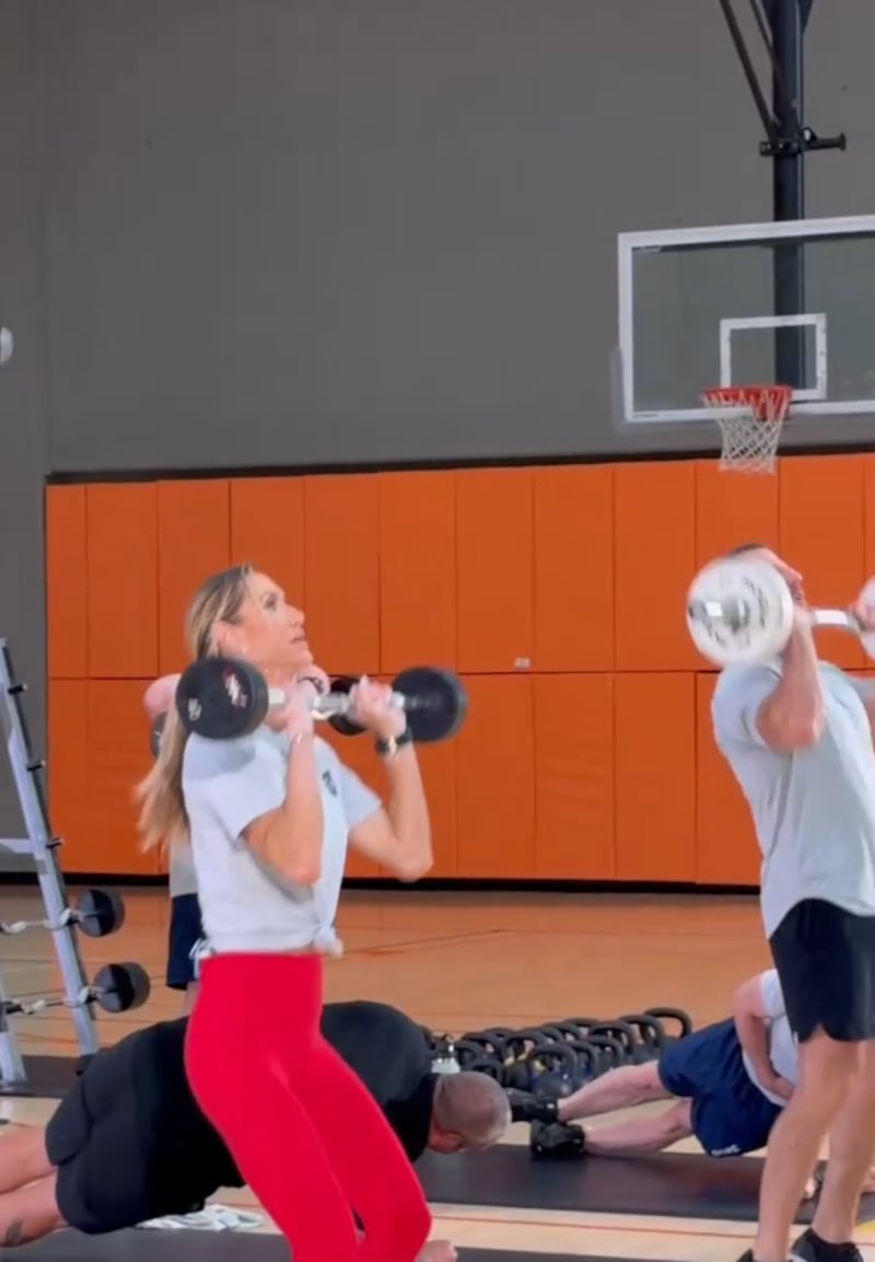 Lara Trump hoists a barbell during the session, which Mullin said she got through without missing a rep.