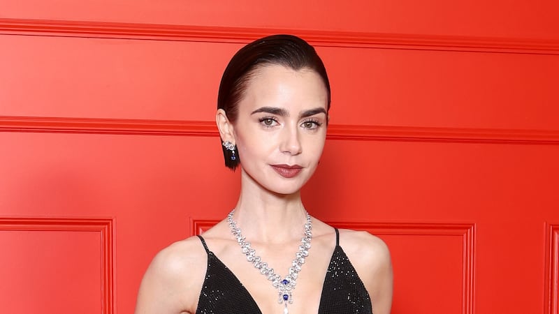 Lily Collins attends the Season 5 premiere of 'Emily In Paris' at Le Grand Rex in Paris on December 15, 2025.