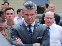 ARLINGTON, VIRGINIA - JULY 16: U.S. Secretary of Defense Pete Hegseth (L) is briefed on an exhibit of Multi-Domain Autonomous systems by Alexander Lovett (L), Deputy Assistant Secretary of Defense Prototyping and Experimentation and Emil Michael (R), Under Secretary of Defense (Research & Engineering, at the Pentagon July 16, 2025 in Arlington, Virginia. The exhibit, created by the office of the Under Secretary of Defense for Research and Engineering, highlights systems developed for the Defense Department intended to maintain a technological for the U.S. military. (Photo by Win McNamee/Getty Images)
