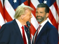 Donald Trump arrives to speak with Donald Trump Jr. during an election night event at the Palm Beach Convention Center on November 06, 2024 in West Palm Beach, Florida.