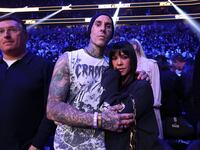 Travis Barker and his wife Kourtney Kardashian attend the UFC 324 event in January 2026.