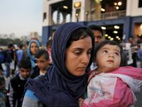 articles/2015/07/20/on-the-black-road-into-europe-with-syria-s-refugees/150719-psarapoulos-greece-syrians-tease_shlijz