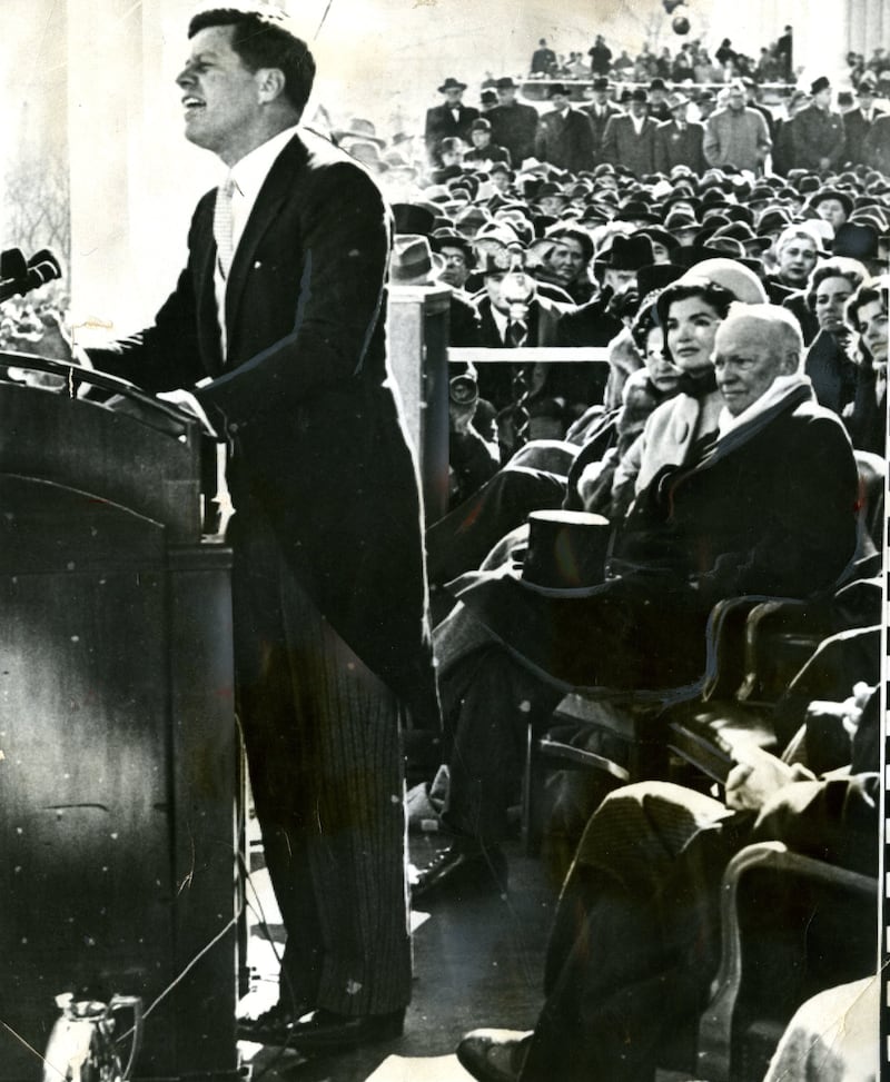 WASHINGTON, DC - JANUARY 20: President John F Kennedy (1917 - 1963) delivers his inaugural address, Washington DC, January 20, 1961. Among those seated are First Lady Jacqueline Kennedy (nee Bouvier, later Onassis, 1929 – 1994) and outgoing President Dwight Eisenhower (1890 - 1969). (Photo by Boston Globe Staff/The Boston Globe via Getty Images)