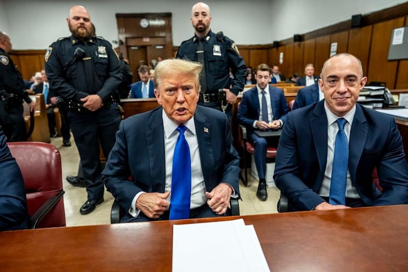 Donald Trump sits with attorney Emil Bove during his criminal trial at Manhattan Criminal Court.