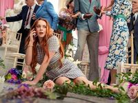 Lindsay Lohan sprawled on the ground in a still from ‘Irish Wish’