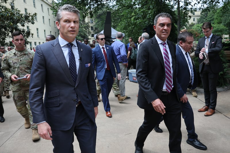 U.S. Secretary of Defense Pete Hegseth (L) walks with Emil Michael (R), Under Secretary of Defense (Research & Engineering, while touring an exhibit of Multi-Domain Autonomous systems at the Pentagon July 16, 2025 in Arlington, Virginia.