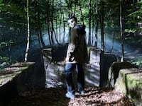 A photo including a still from the film The Strangers: Chapter 1