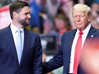Former U.S. President Donald Trump stands with Republican vice presidential nominee U.S. Senator J.D. Vance (R-OH), as he holds a rally for the first time with his running mate, in Grand Rapids, Michigan, July 20, 2024.
