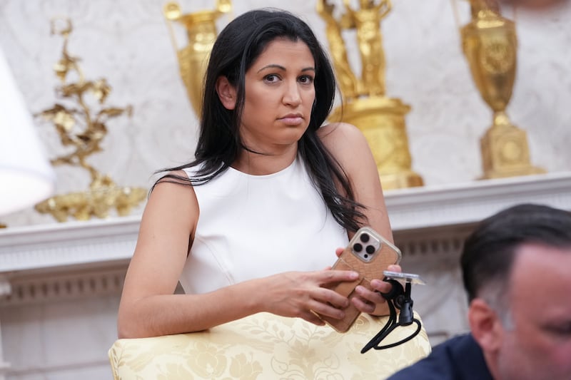 White House Deputy Chief of Staff Stephen Miller's wife Katie Miller listens as President Donald Trump and Elon Musk speak to reporters in the Oval Office of the White House on May 30, 2025 as he departs his official tine as a White House adviser.