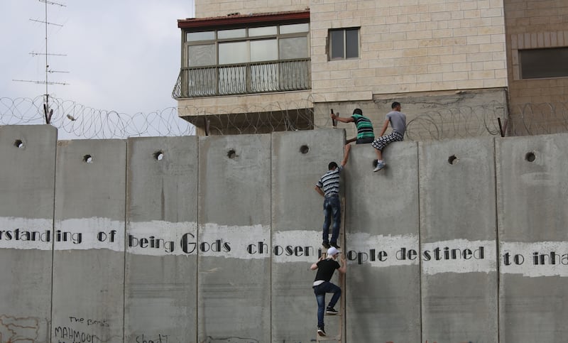 articles/2013/07/12/the-first-friday-of-ramadam-for-palestinians/climbing-wall-openz_kkjk4t